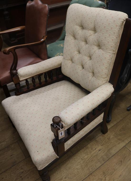 An Edwardian walnut low armchair